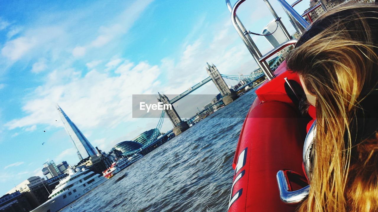 LOW ANGLE VIEW OF MAN ON BOAT