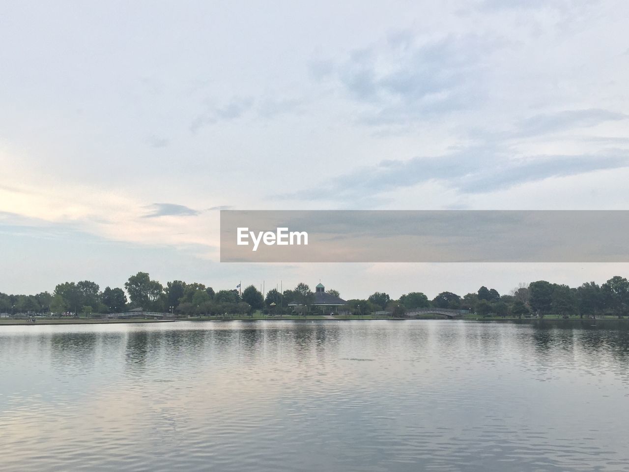 Scenic view of calm lake against sky