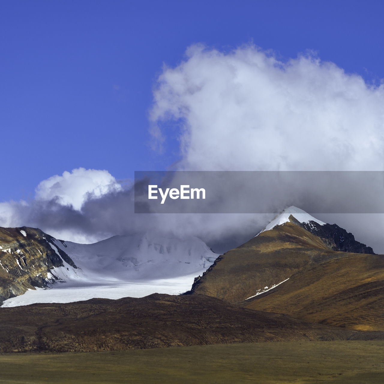 scenic view of mountains against blue sky