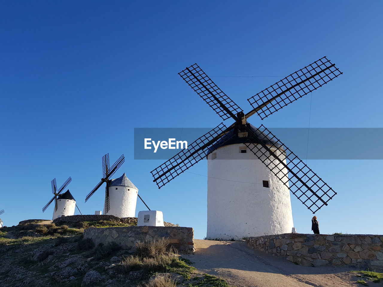 Traditional windmill against clear blue sky