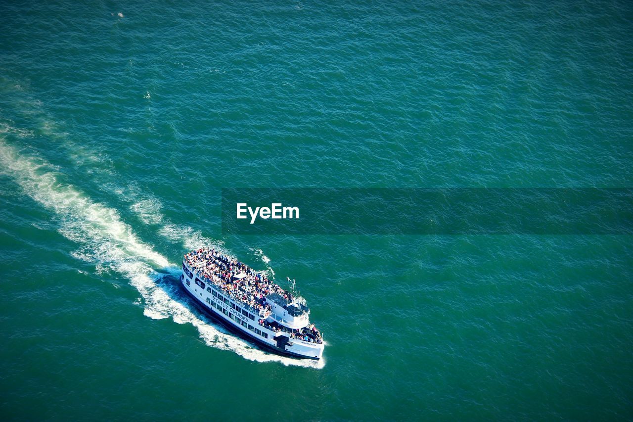 High angle view of crowd traveling on ferry over sea