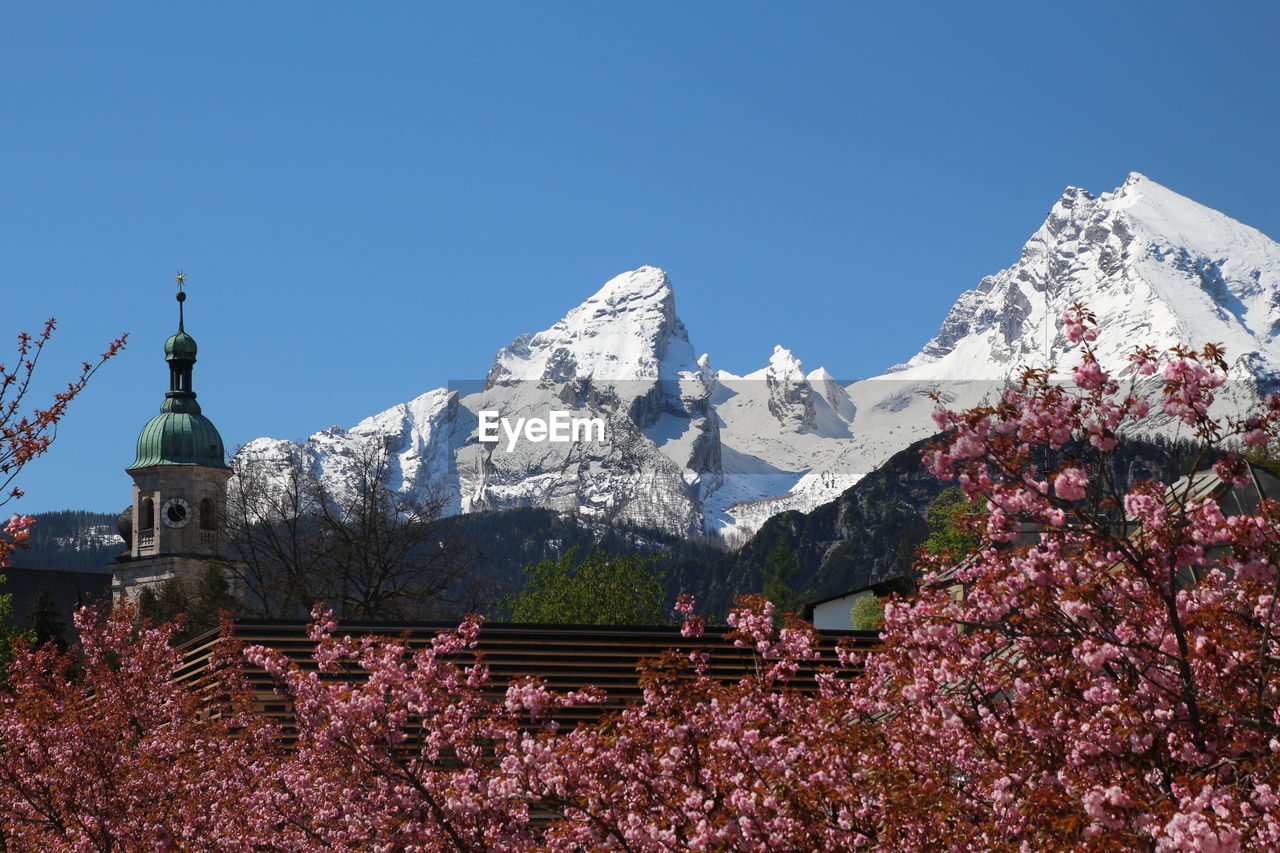 Scenic view of mountains against clear blue sky