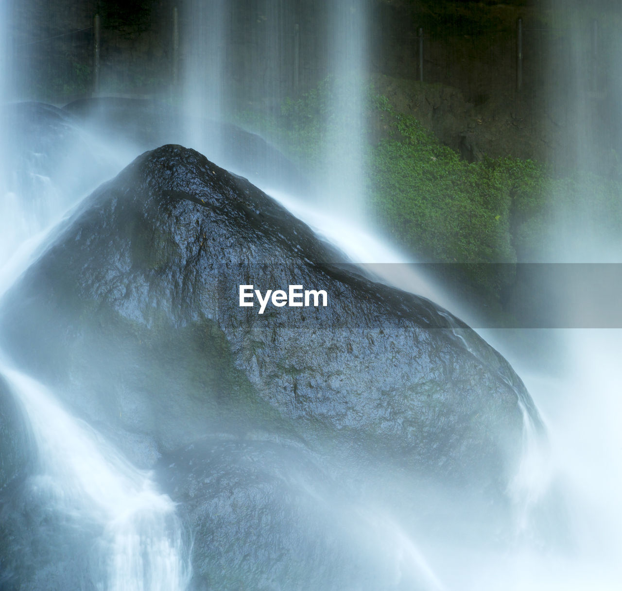 WATER FLOWING FROM ROCKS