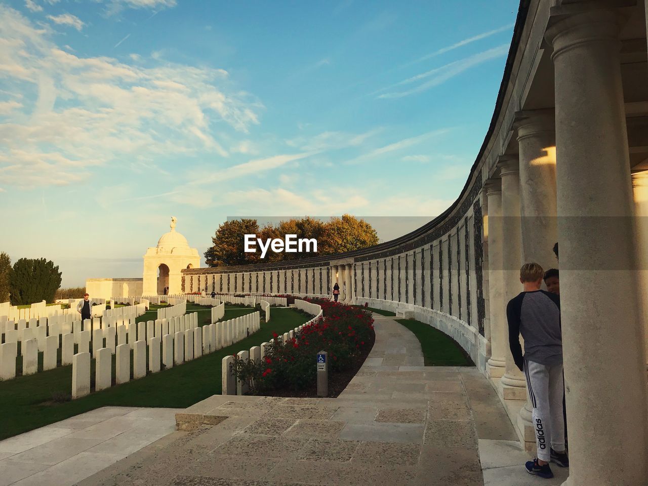 MAN STANDING OUTSIDE TEMPLE AGAINST SKY