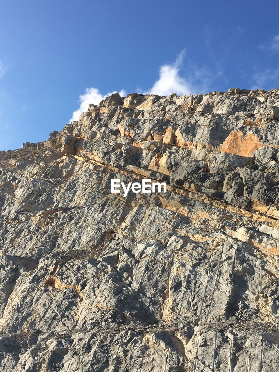 LOW ANGLE VIEW OF SKY OVER MOUNTAIN AGAINST THE BACKGROUND