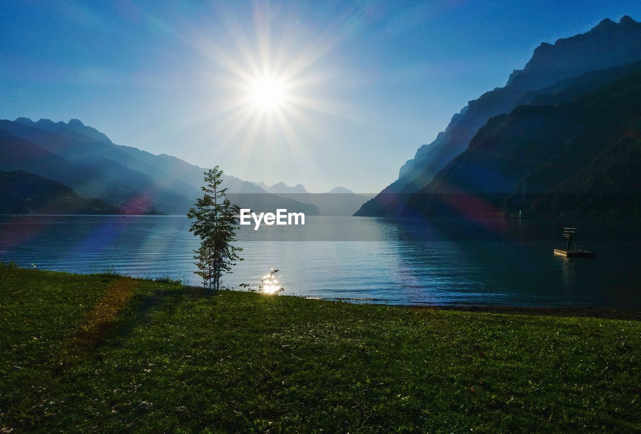 Scenic view of lake against sky during sunset