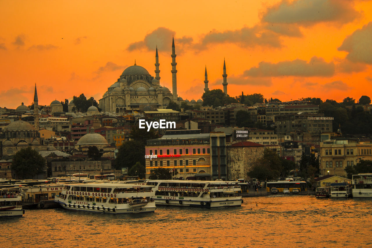 Blue mosque and buildings in front of river