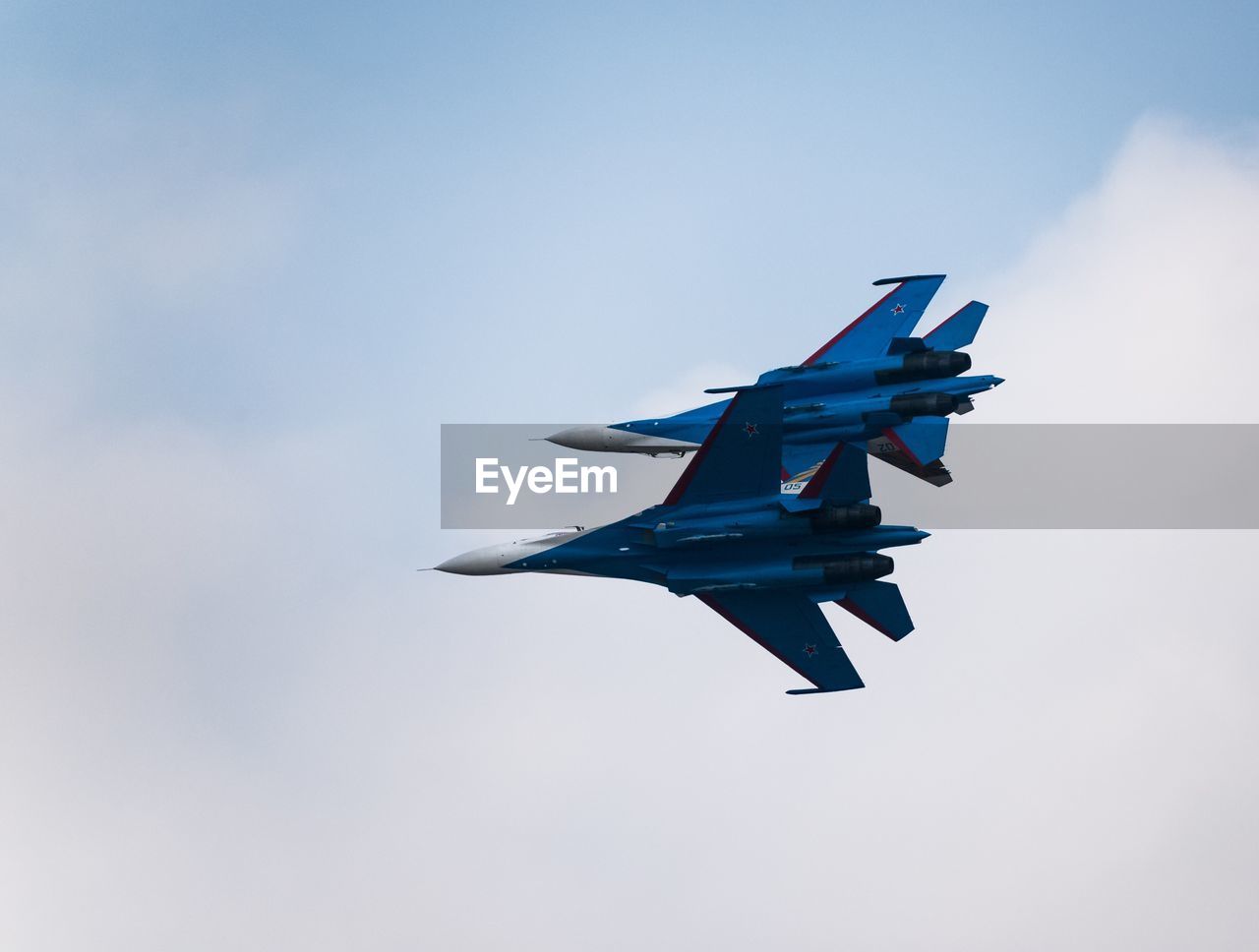 LOW ANGLE VIEW OF AIRPLANE AGAINST SKY