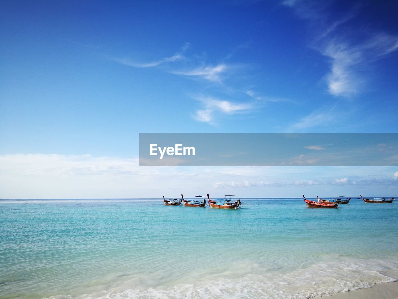 BOAT IN SEA AGAINST SKY