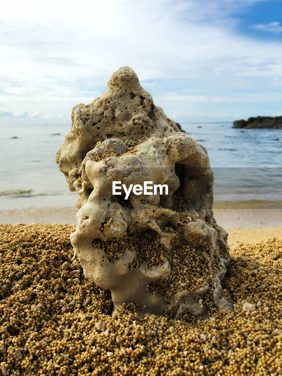 rock, sand, sea, beach, land, water, shore, sky, coast, nature, ocean, beauty in nature, cloud, no people, day, tranquility, outdoors, scenics - nature, horizon over water, tranquil scene, geology, body of water, wave, stone, motion