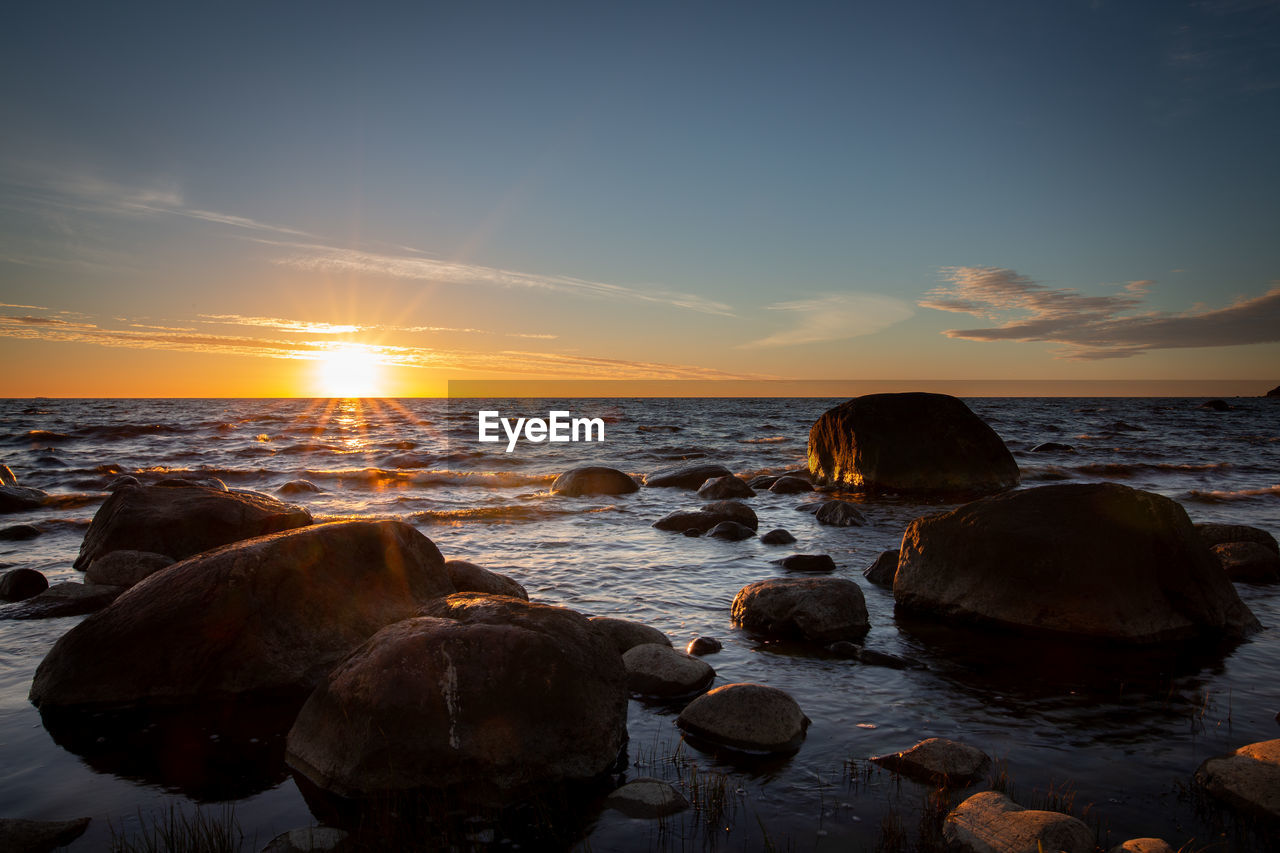 Scenic view of sea against sky during sunset