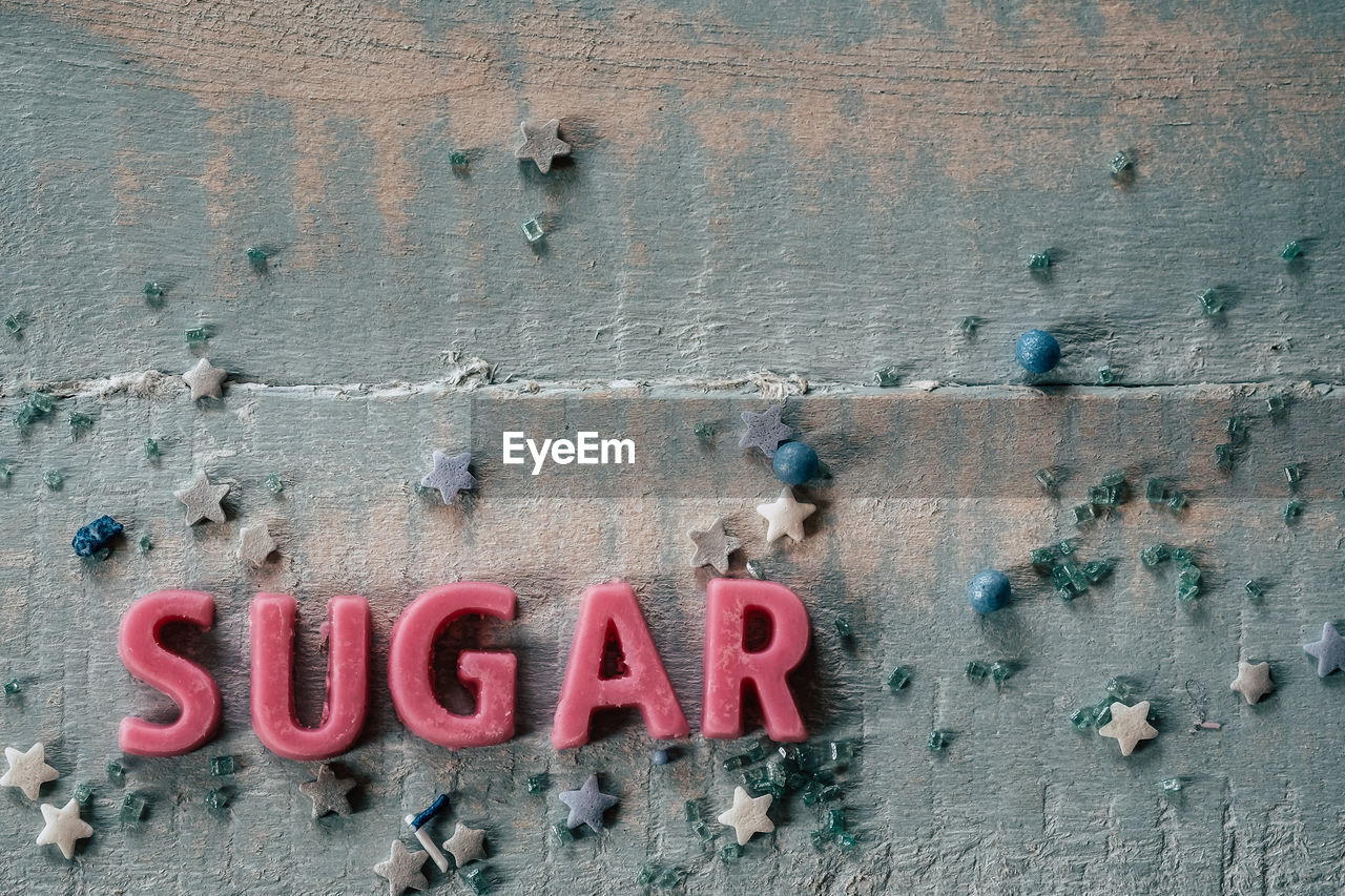 CLOSE-UP OF TEXT ON CONCRETE WALL
