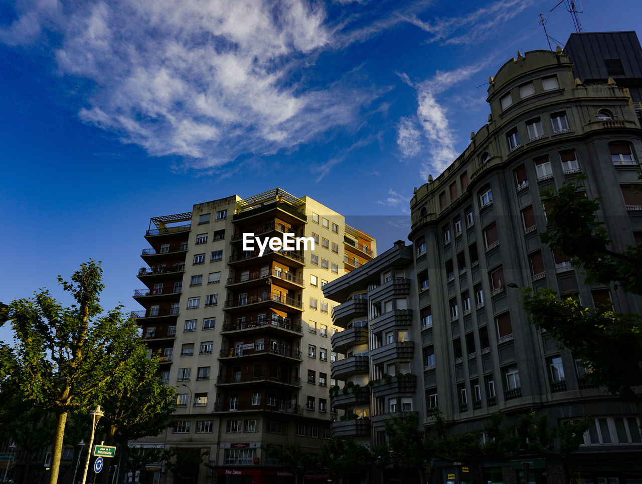 LOW ANGLE VIEW OF RESIDENTIAL BUILDINGS AGAINST SKY