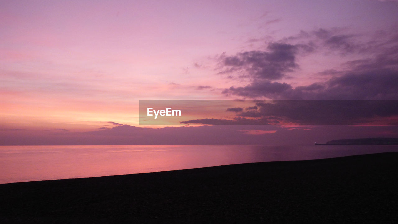 Scenic view of dramatic sky over lake