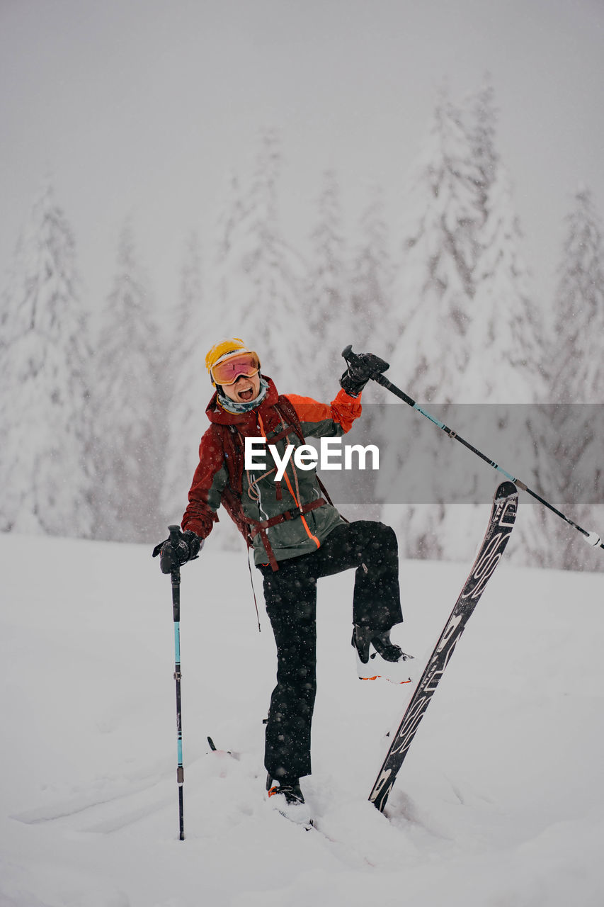 Rear view of girl skiing on snow