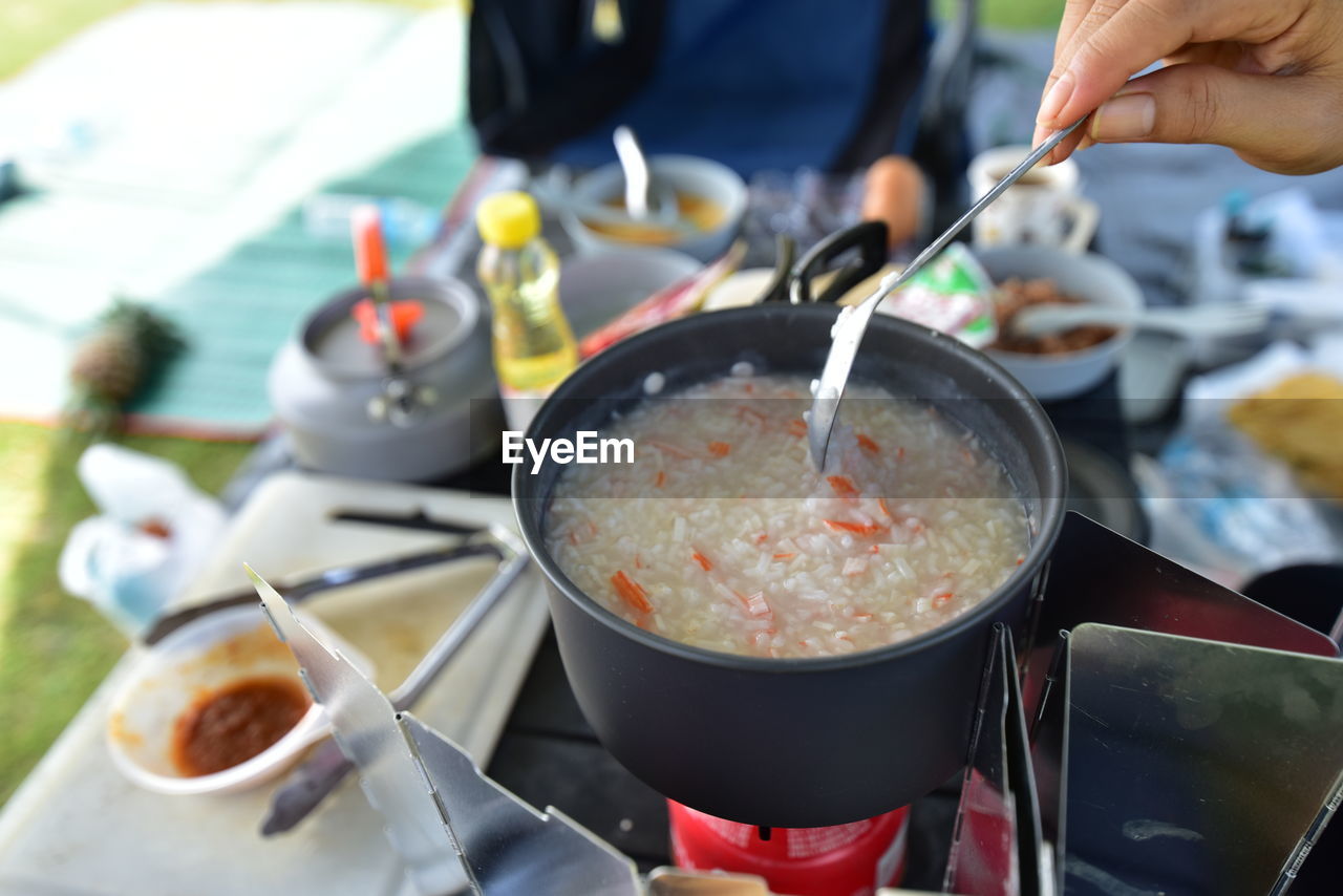 cropped hand of man preparing food