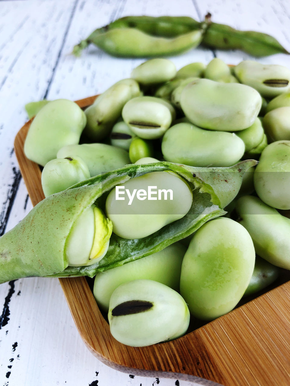 Top view of raw fresh broad beans on table 