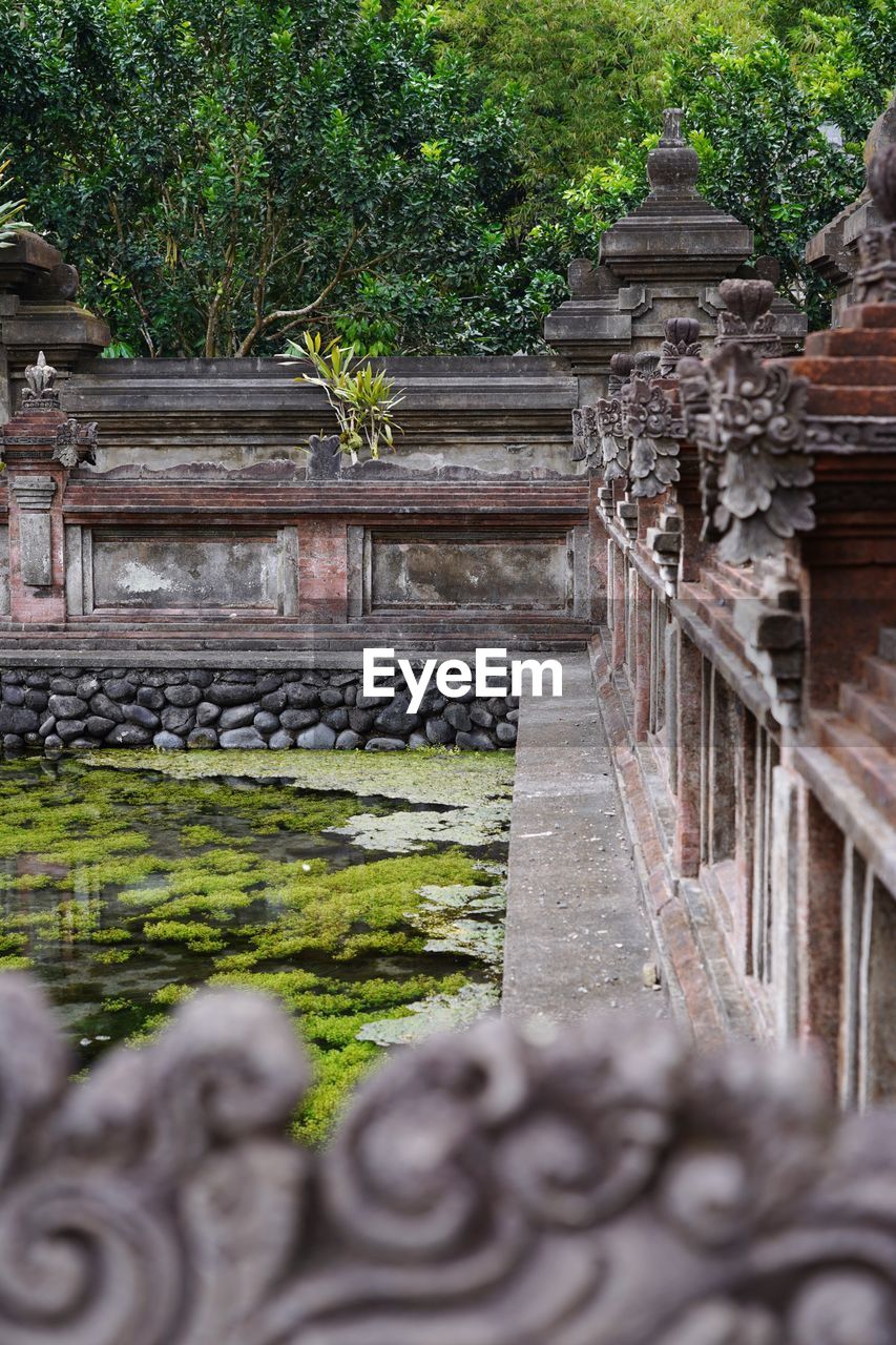 Indonesian temple, a part of, and the pond in the middle of the area.