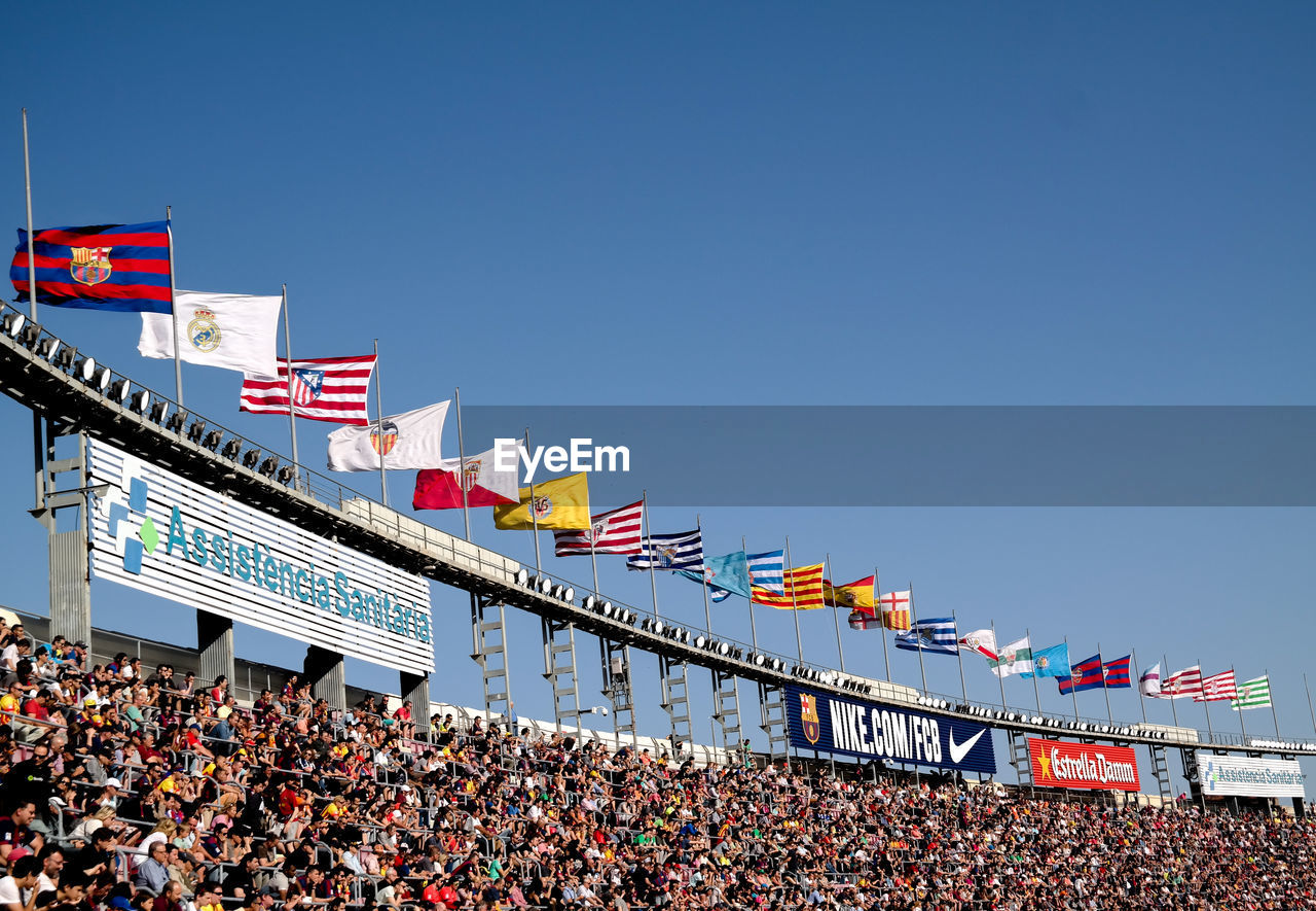 Low angle view of stadium against clear blue sky