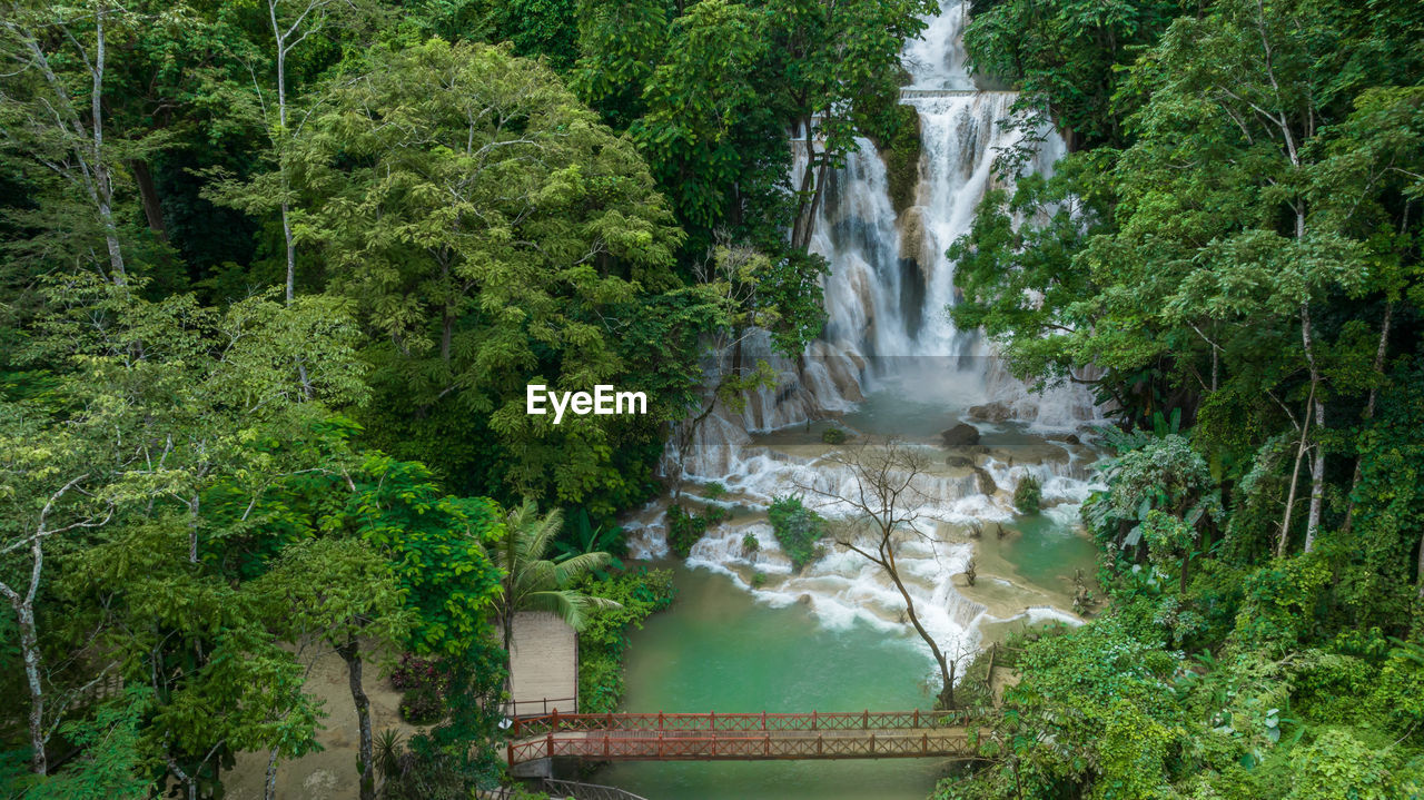 Aerial view tat kuang si waterfall in luang prabang, laos, beautiful waterfall in jungle tropical.