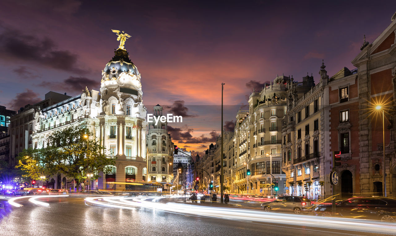 Light trails on gran via in city at dusk