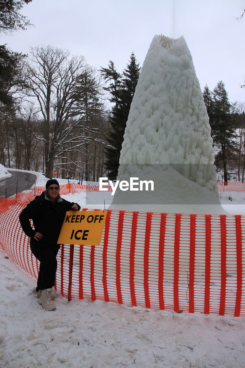 FULL LENGTH OF MAN STANDING ON SNOW