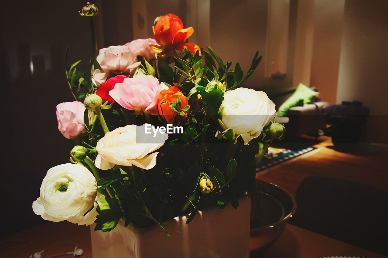 Close-up of flower vase on table