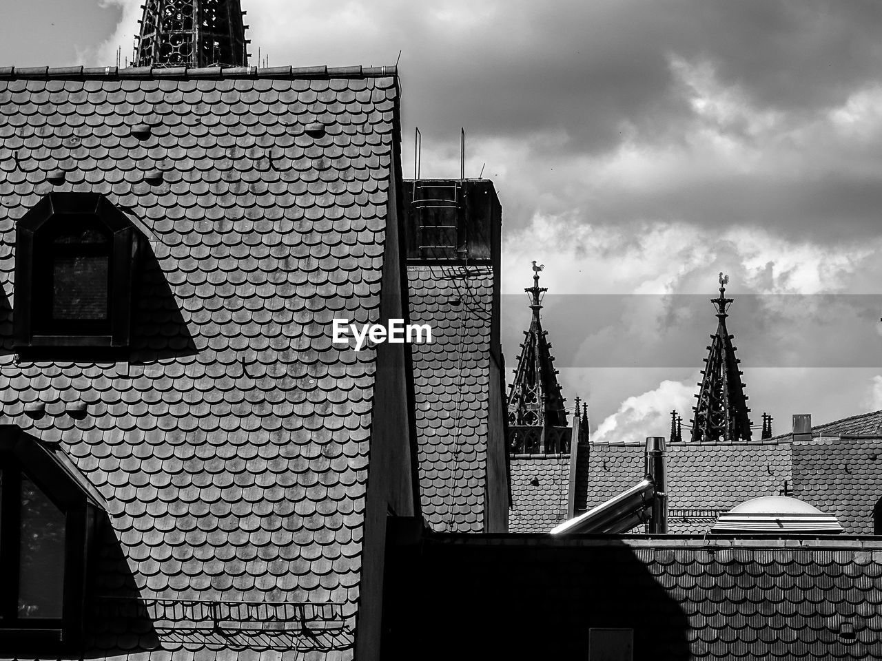 Buildings against cloudy sky