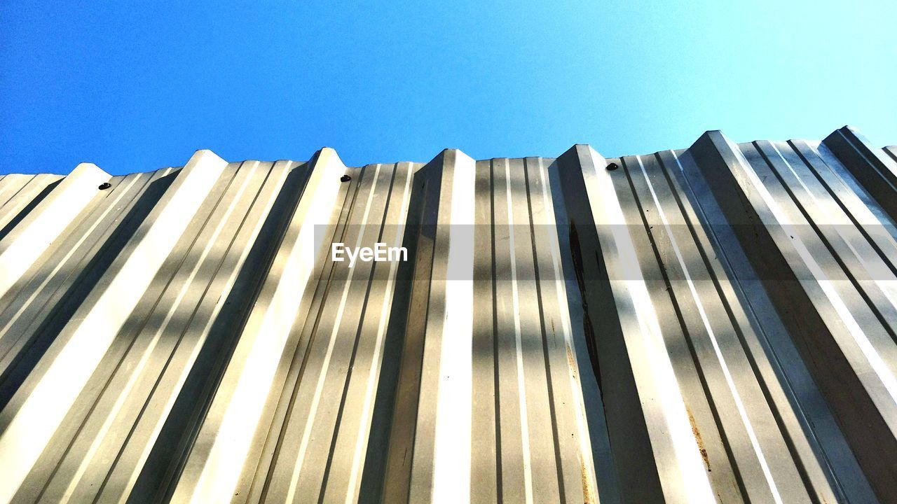 Low angle view of building against blue sky