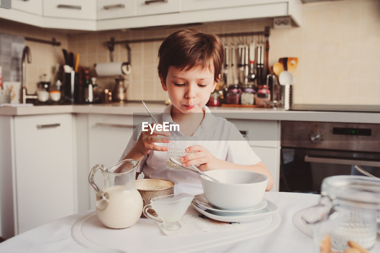 Boy sitting at table