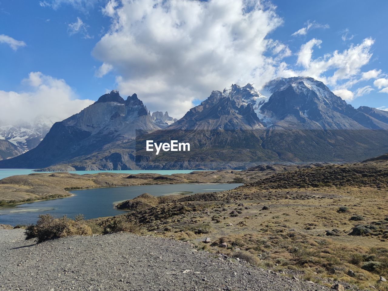 mountain, landscape, scenics - nature, environment, sky, beauty in nature, cloud, wilderness, mountain range, water, nature, lake, snow, land, travel destinations, travel, cold temperature, snowcapped mountain, plateau, winter, no people, tranquil scene, tranquility, highland, tourism, mountain peak, blue, non-urban scene, outdoors, day, ridge, moraine, valley, rock, glacier