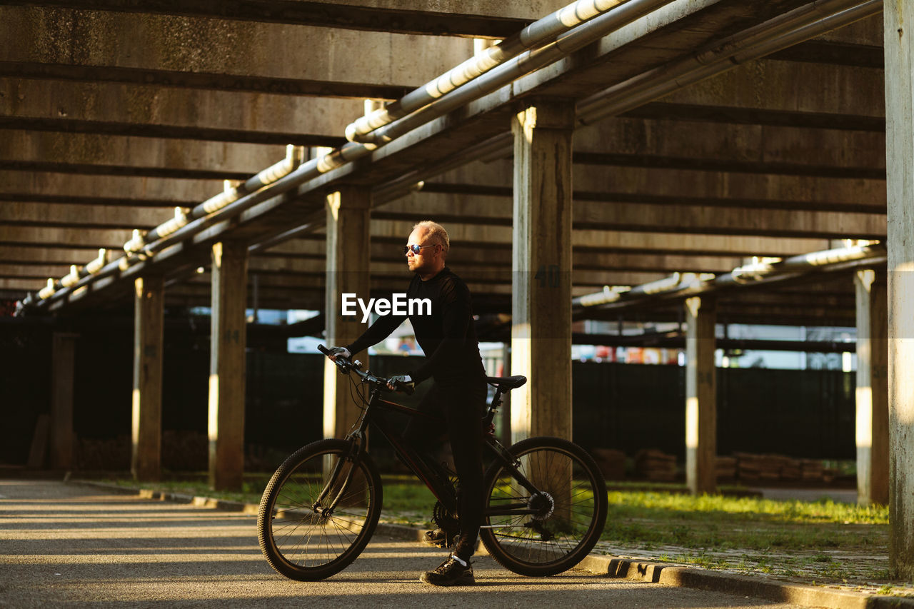 Man riding bicycle at park