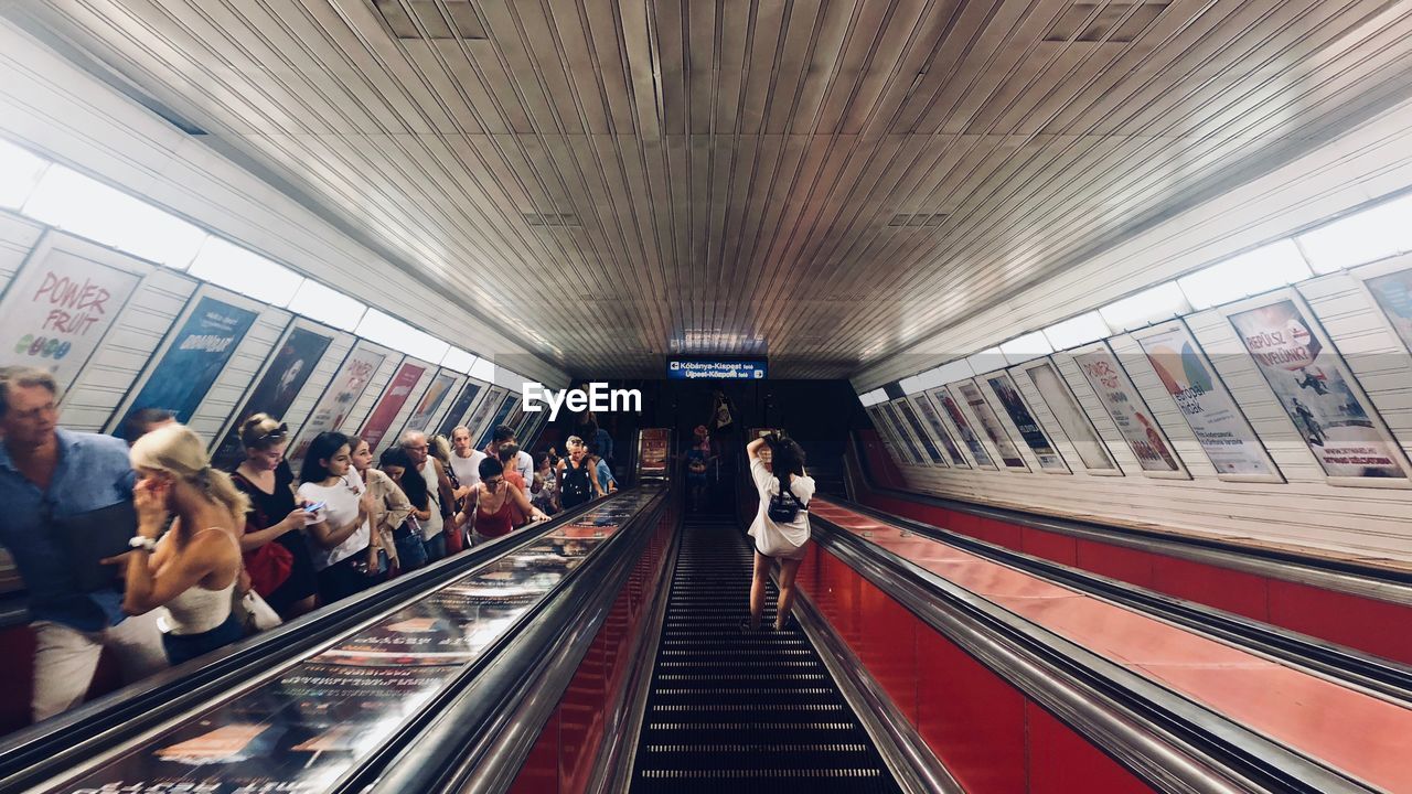 PEOPLE AT SUBWAY STATION