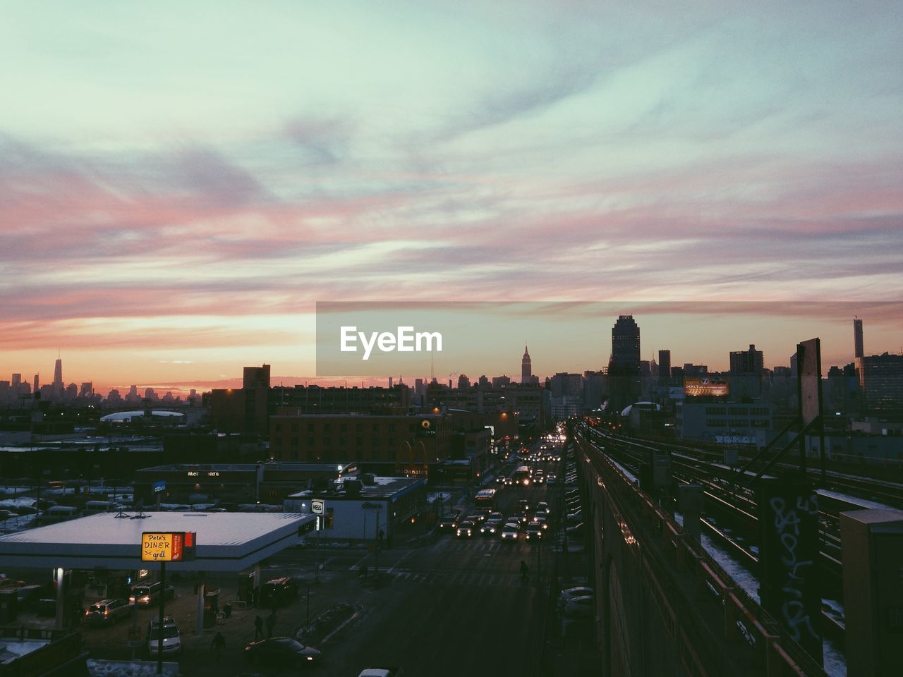 VIEW OF CITYSCAPE AT SUNSET
