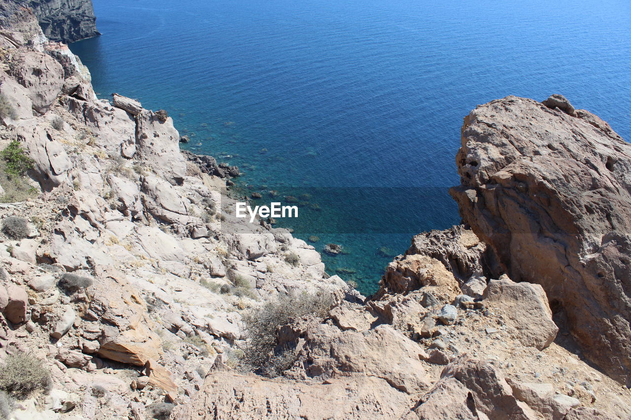 High angle view of rocks on shore