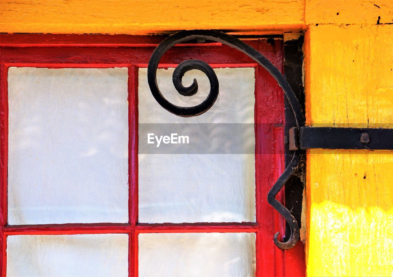 Close-up of iron scroll window corner