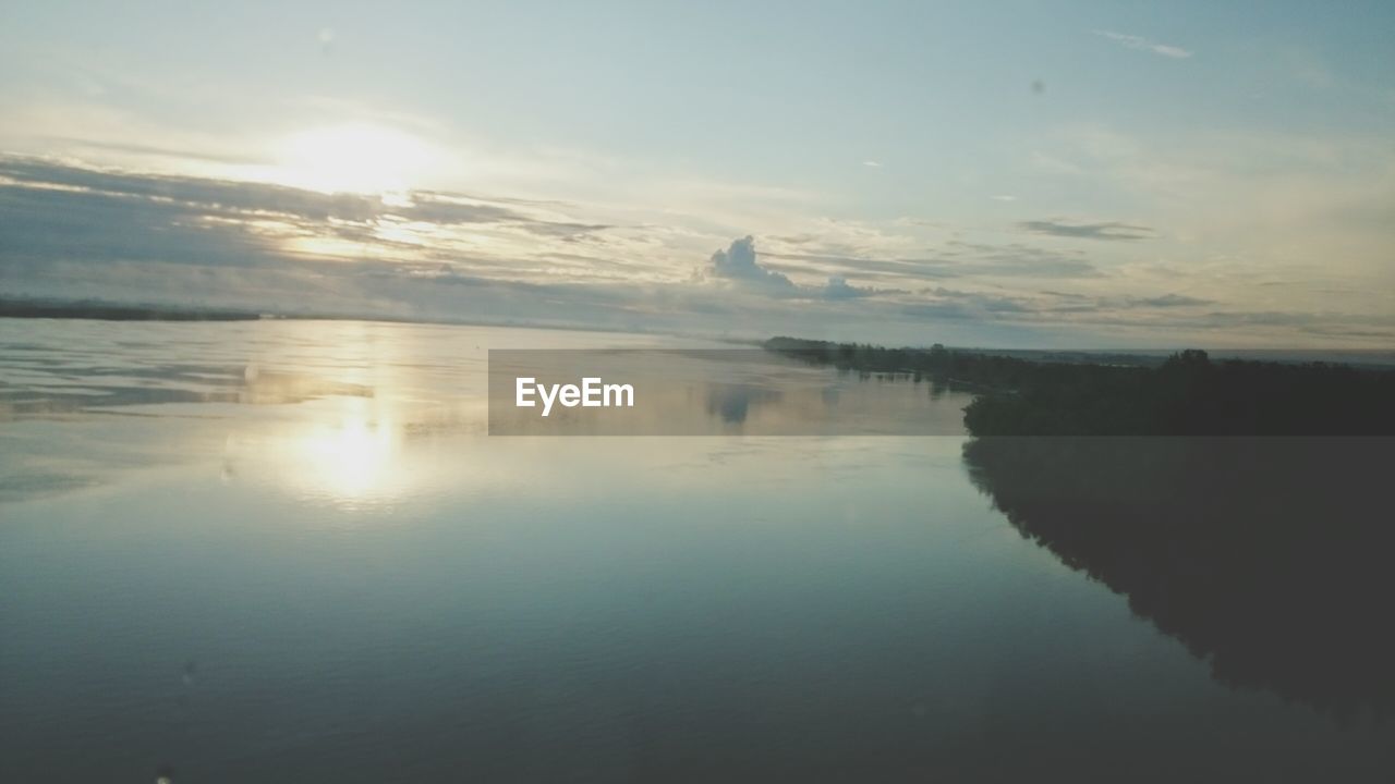 SCENIC VIEW OF SUNSET OVER SEA