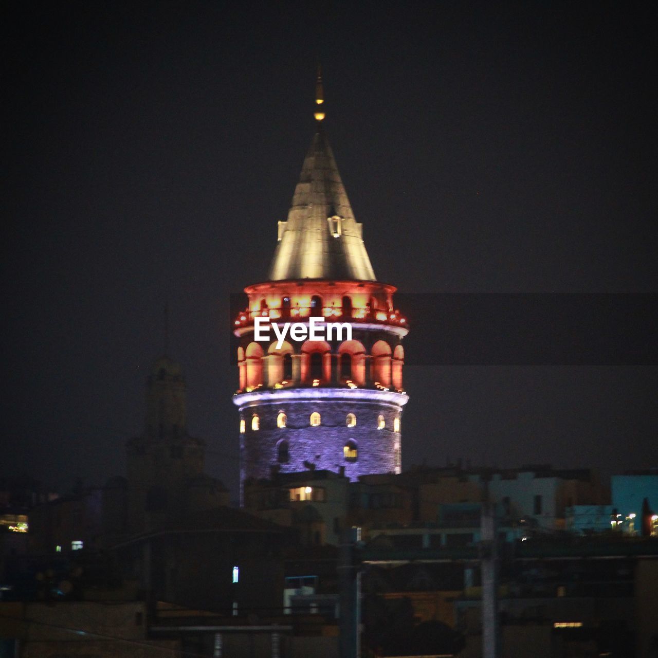 ILLUMINATED CLOCK TOWER AT NIGHT