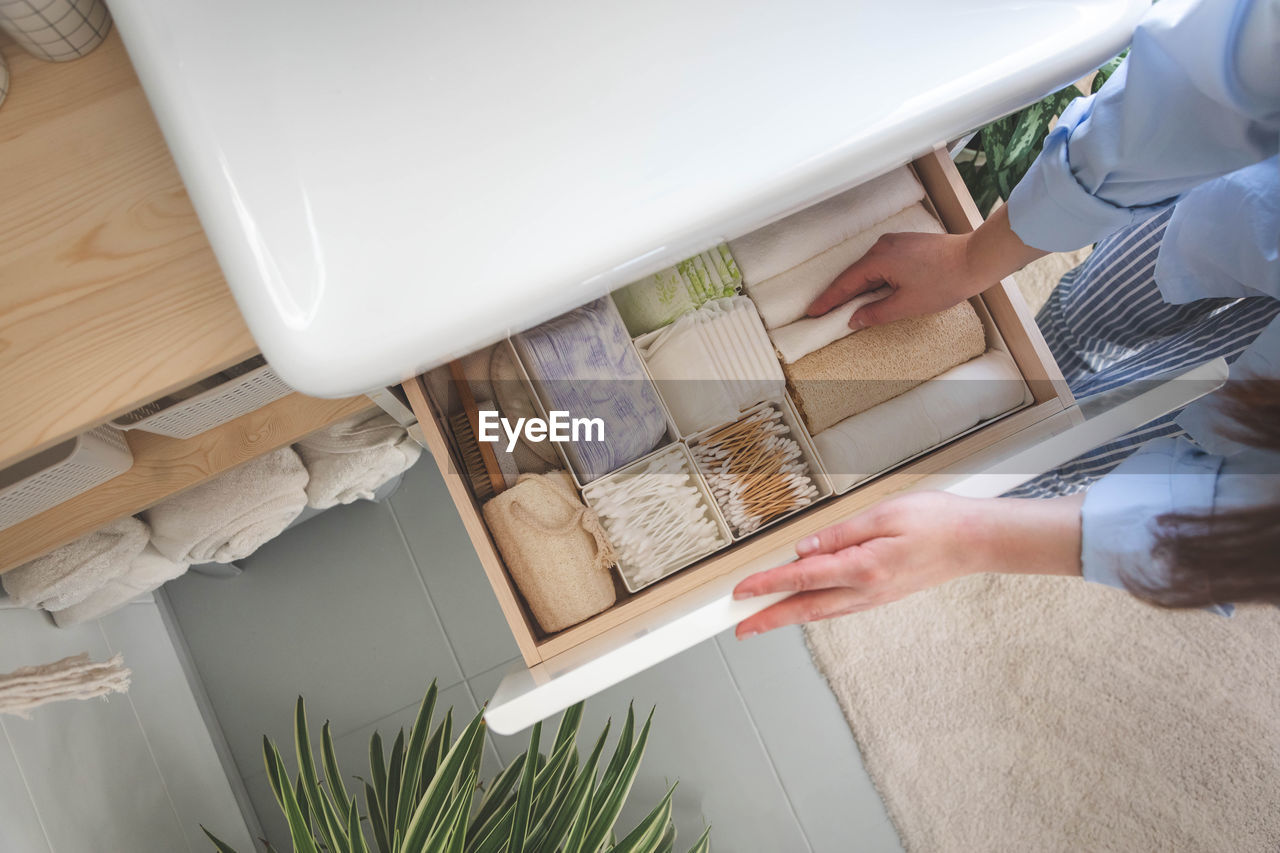 high angle view of woman using digital tablet on table