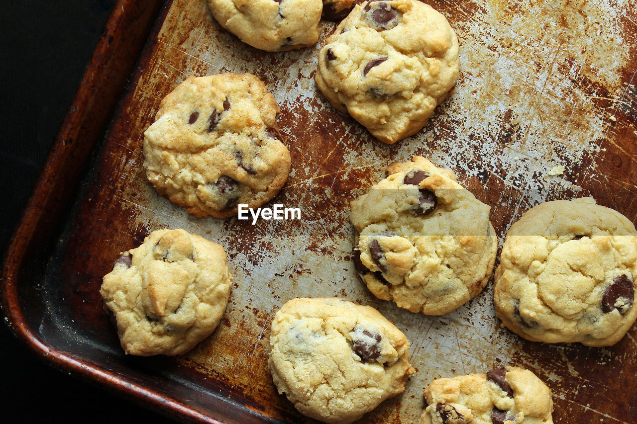 Directly above shot of cookies arranged on rusty tray