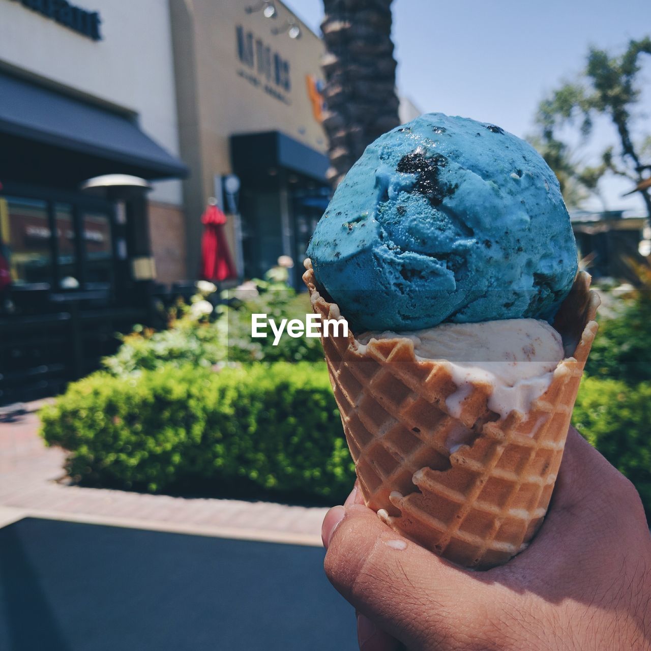 Cropped hand holding ice cream cone