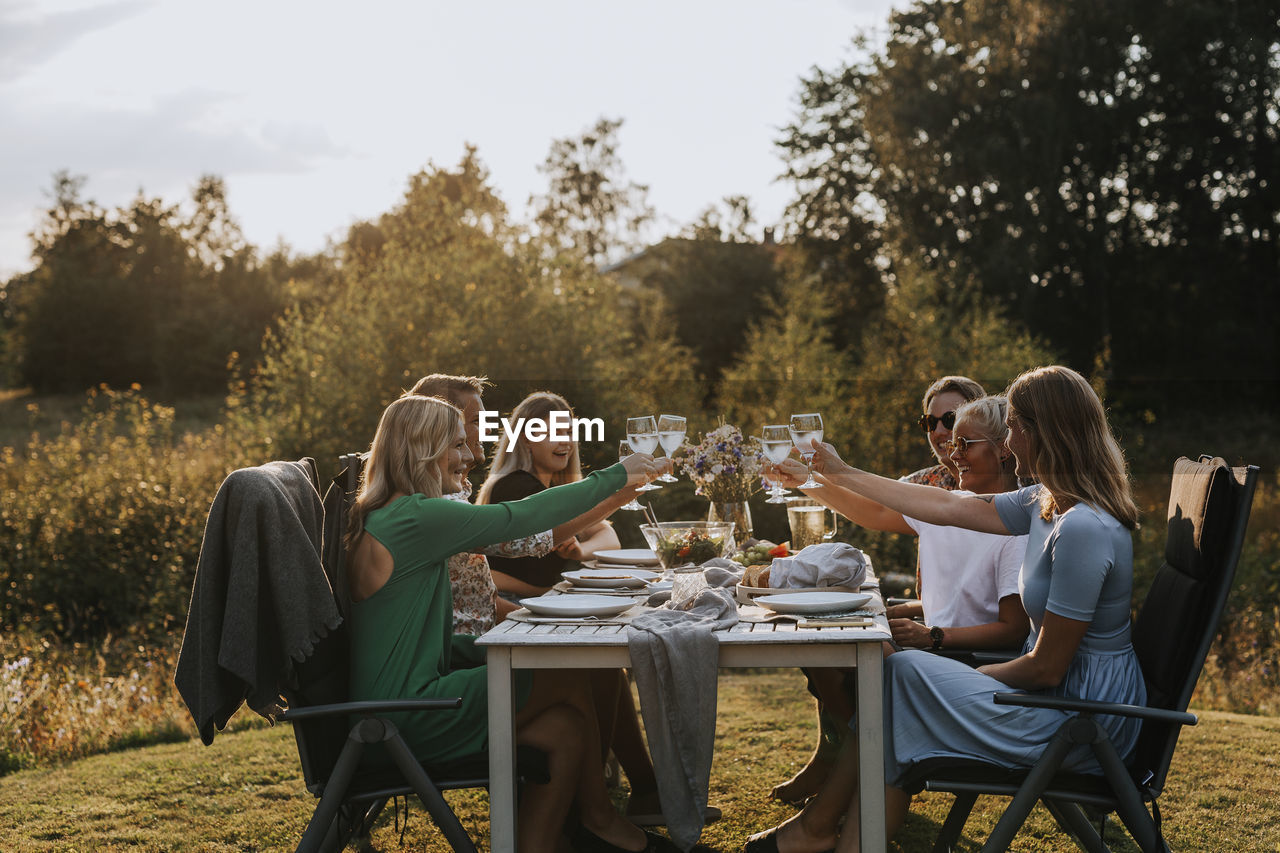 Friends having meal in garden