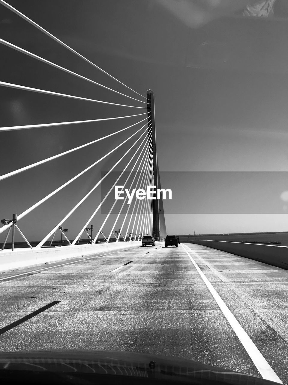 Low angle view of suspension bridge against sky