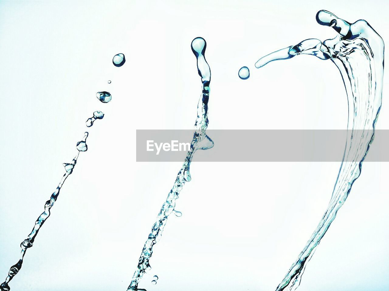 CLOSE-UP OF WATER DROP AGAINST SKY