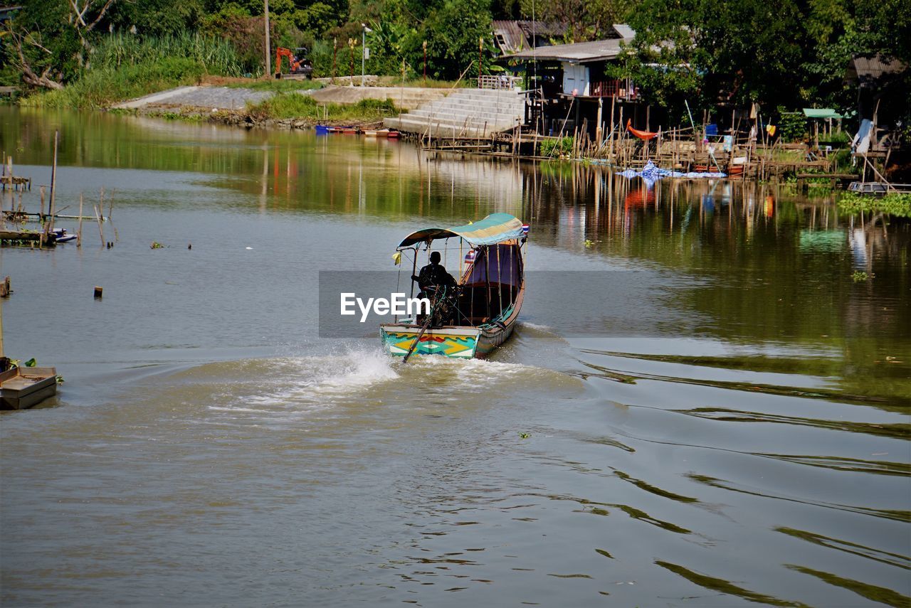 Man sailing in lake