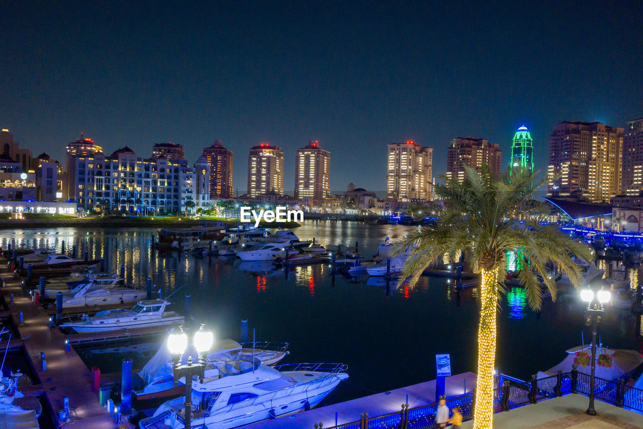 Illuminated buildings in city at night