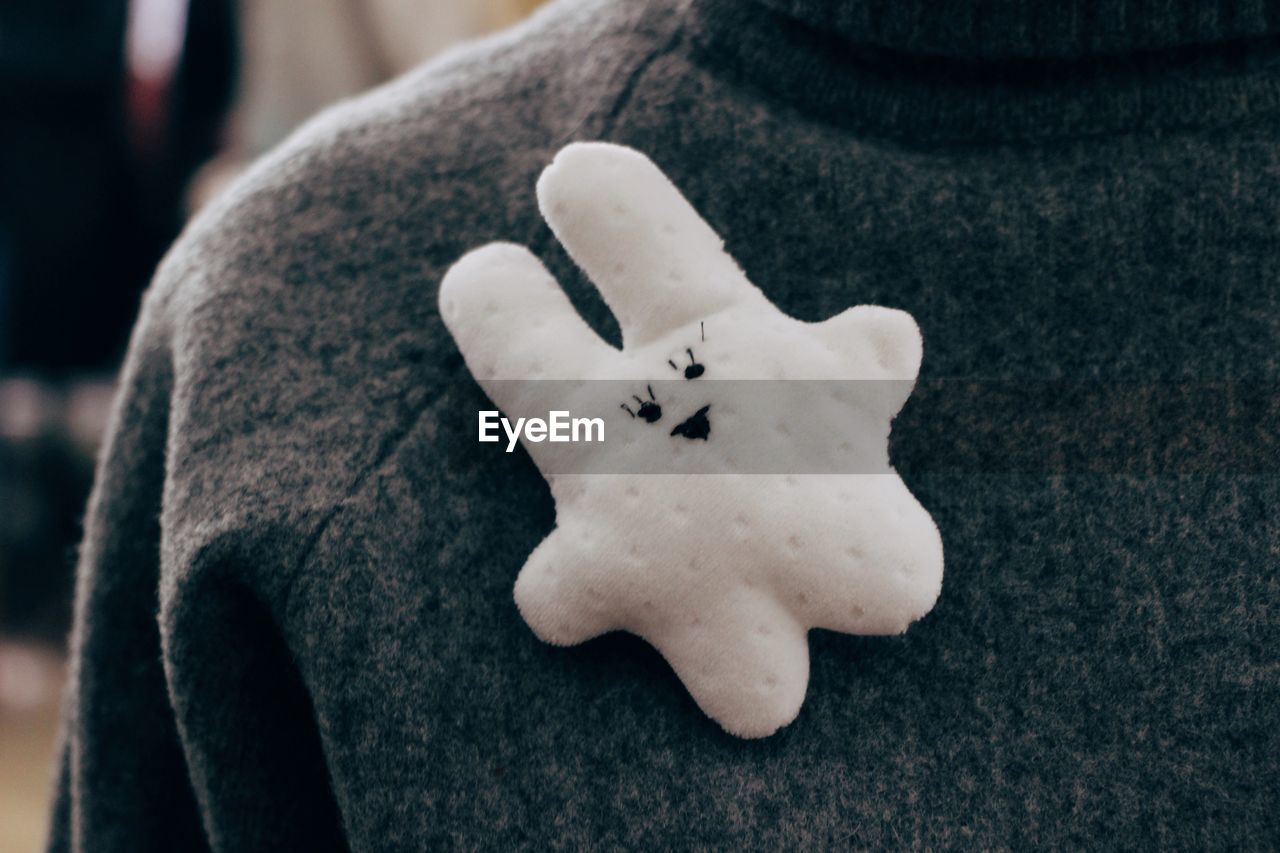 HIGH ANGLE VIEW OF STUFFED TOY ON TABLE DURING WINTER