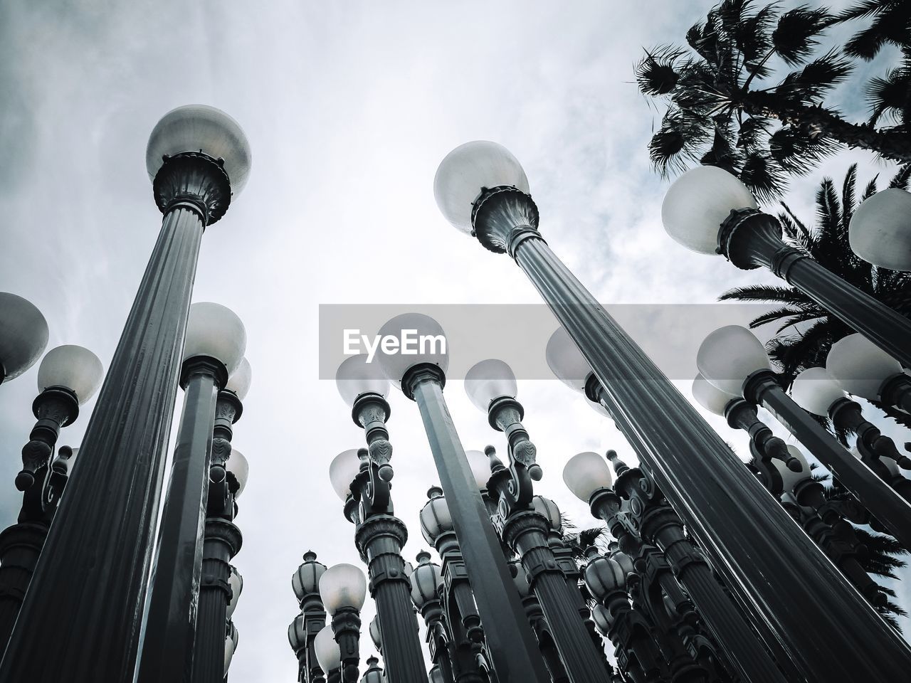 LOW ANGLE VIEW OF STREET LIGHTS AGAINST SKY IN BACKGROUND