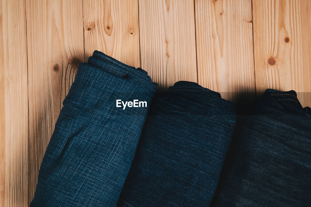 Directly above shot of rolled textiles on table