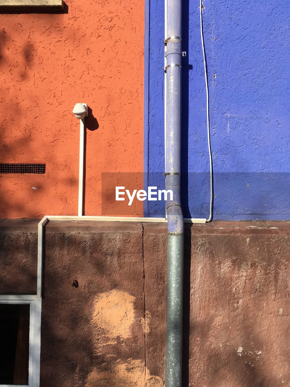 CLOSE-UP OF PIPES AGAINST BLUE SKY